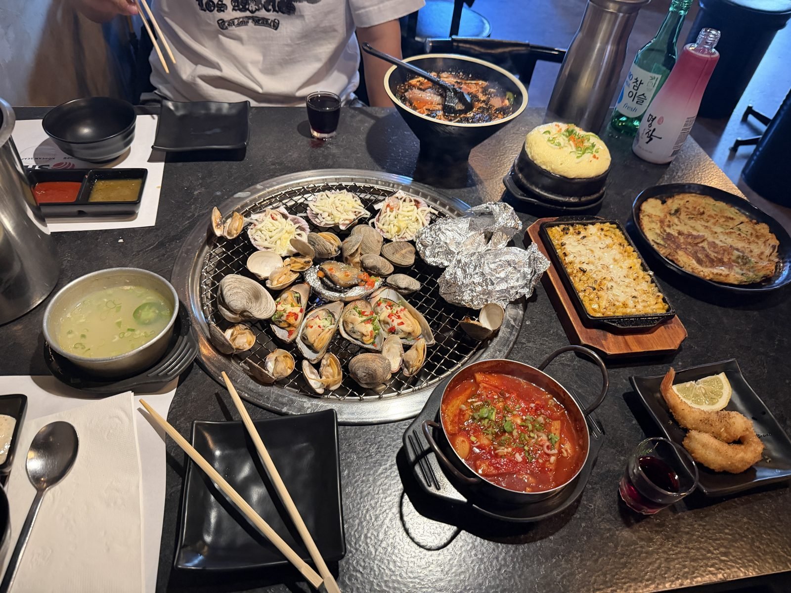 Staff grilling seafood at Burnin' Shell, Koreatown LA