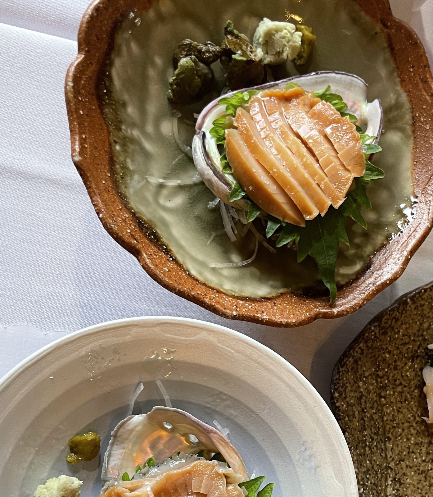 Sliced abalone fanned back into its shell at Matsumoto sushi
