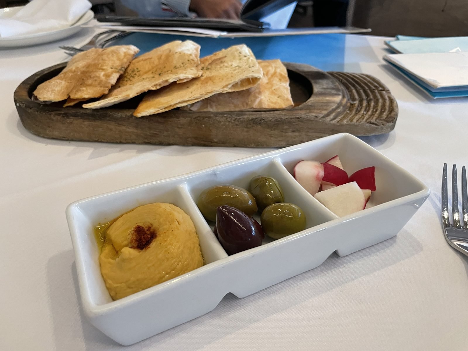 Pita bread and classic Greek spreads at Avra Beverly Hills