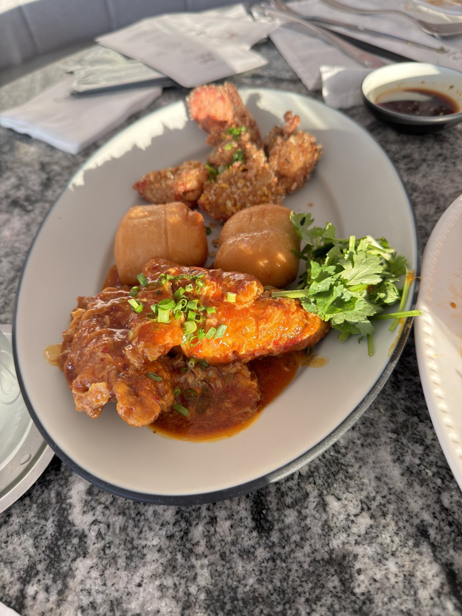 Chili crab with fried mantou buns, radish and coriander at Crab 52 Seoul