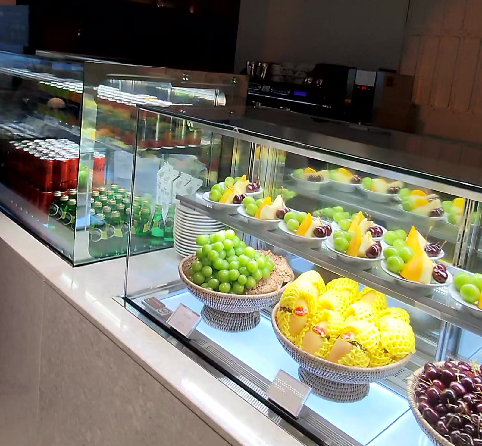 Lit fruit case with melon, green grapes, mango and cherries at Crab 52 Seoul