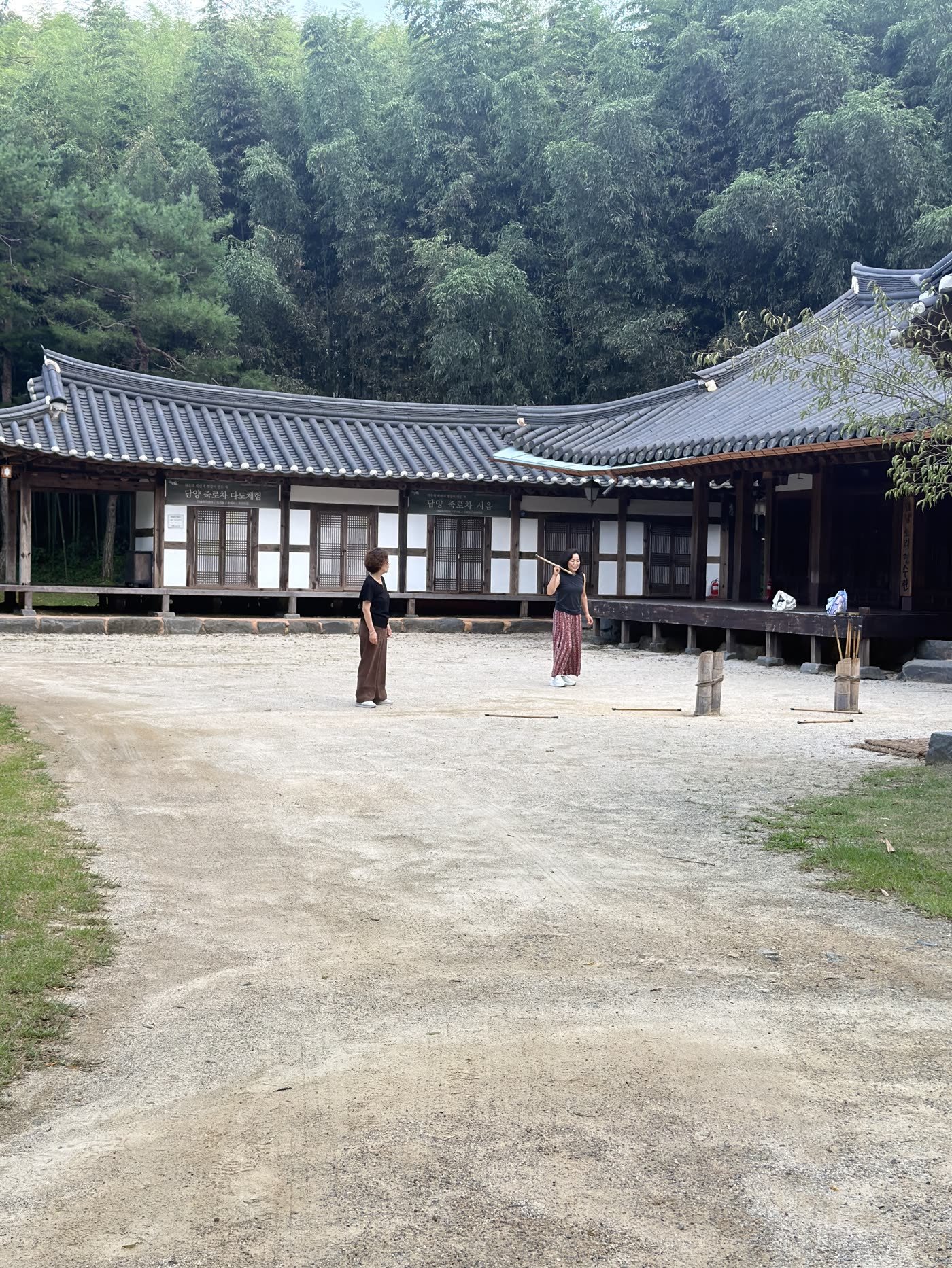 A traditional hanok building set against the bamboo hillside inside Juknokwon, Damyang