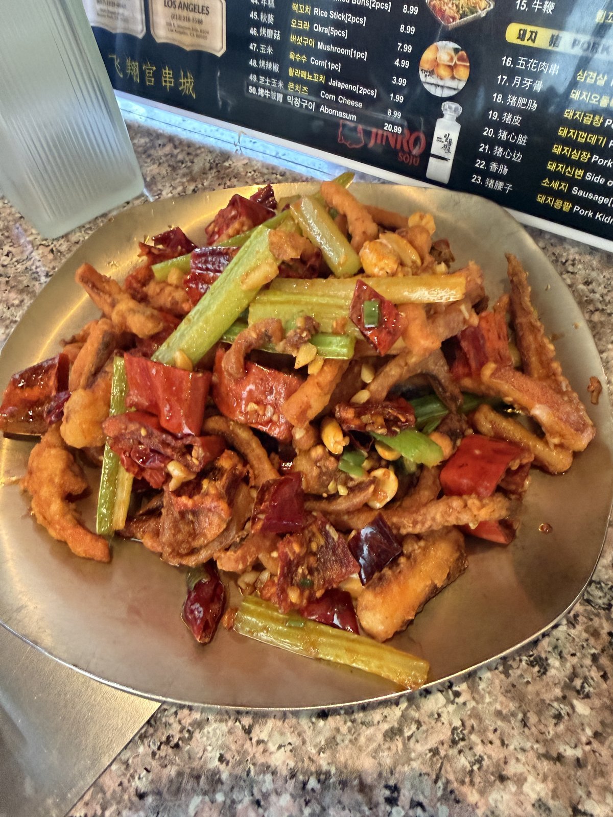 Plate of dry-fried spicy squid with celery and peppers at Fei Xiang Gong in Los Angeles Koreatown