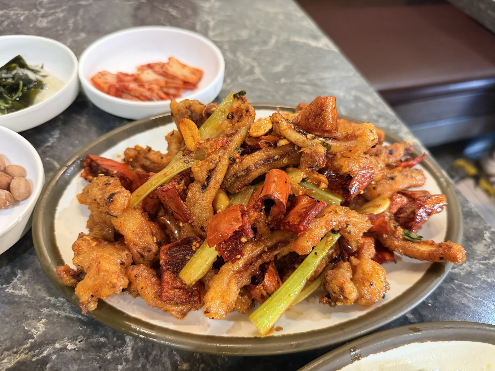 Plate of dry-fried spicy squid with celery and peppers at Feng Mao in Los Angeles Koreatown