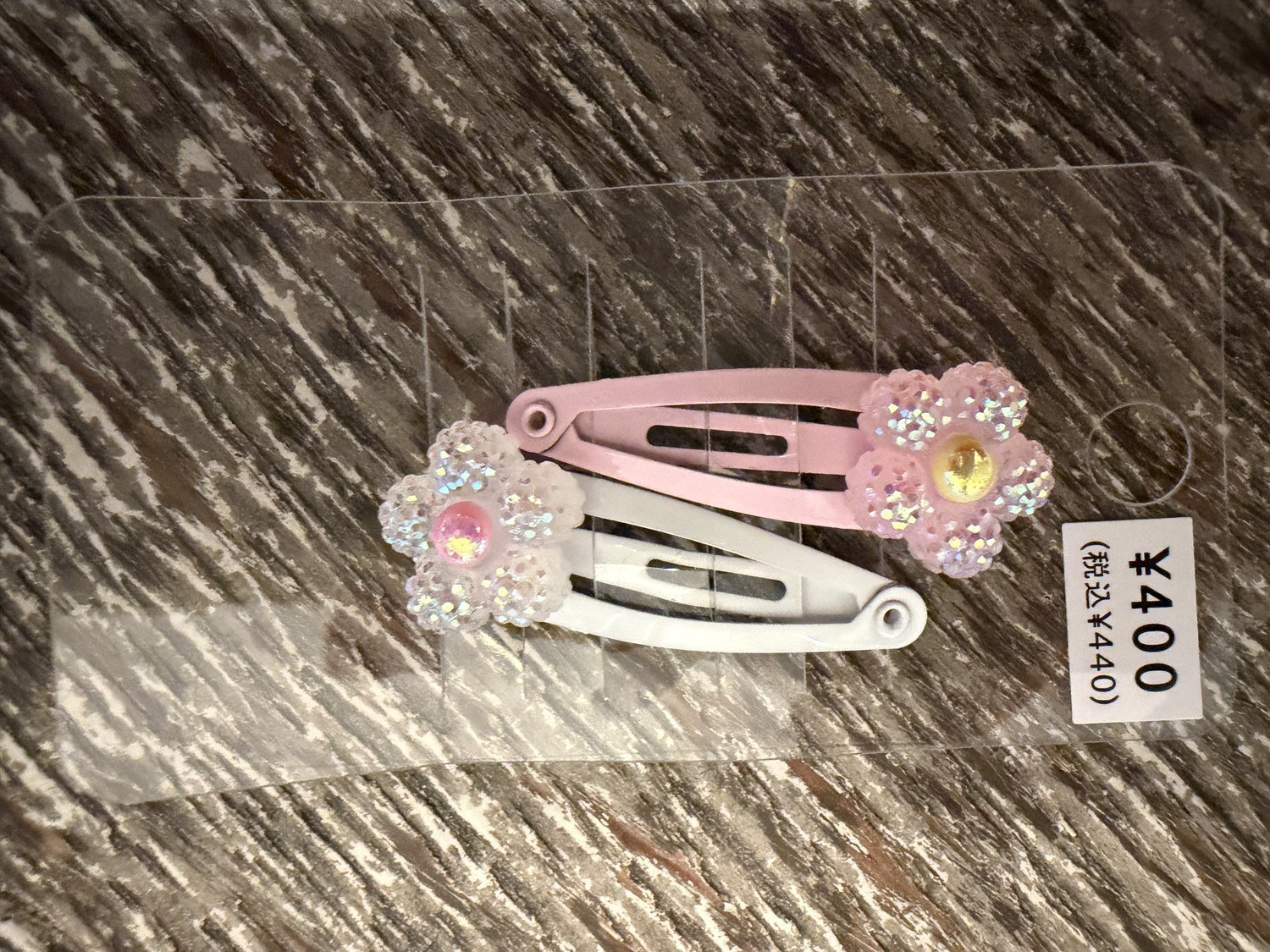 Pink and white flower snap hair clips bought on Takeshita Street for 440 yen