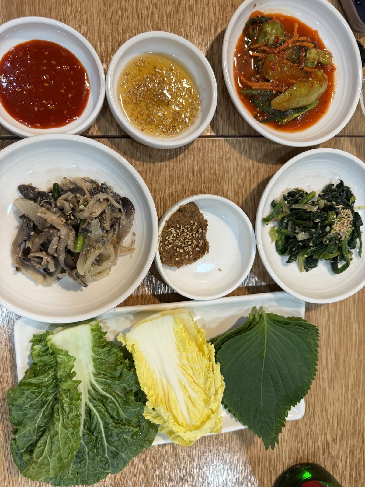 Seasonal banchan and wrapping greens at Gowonnim Seoul