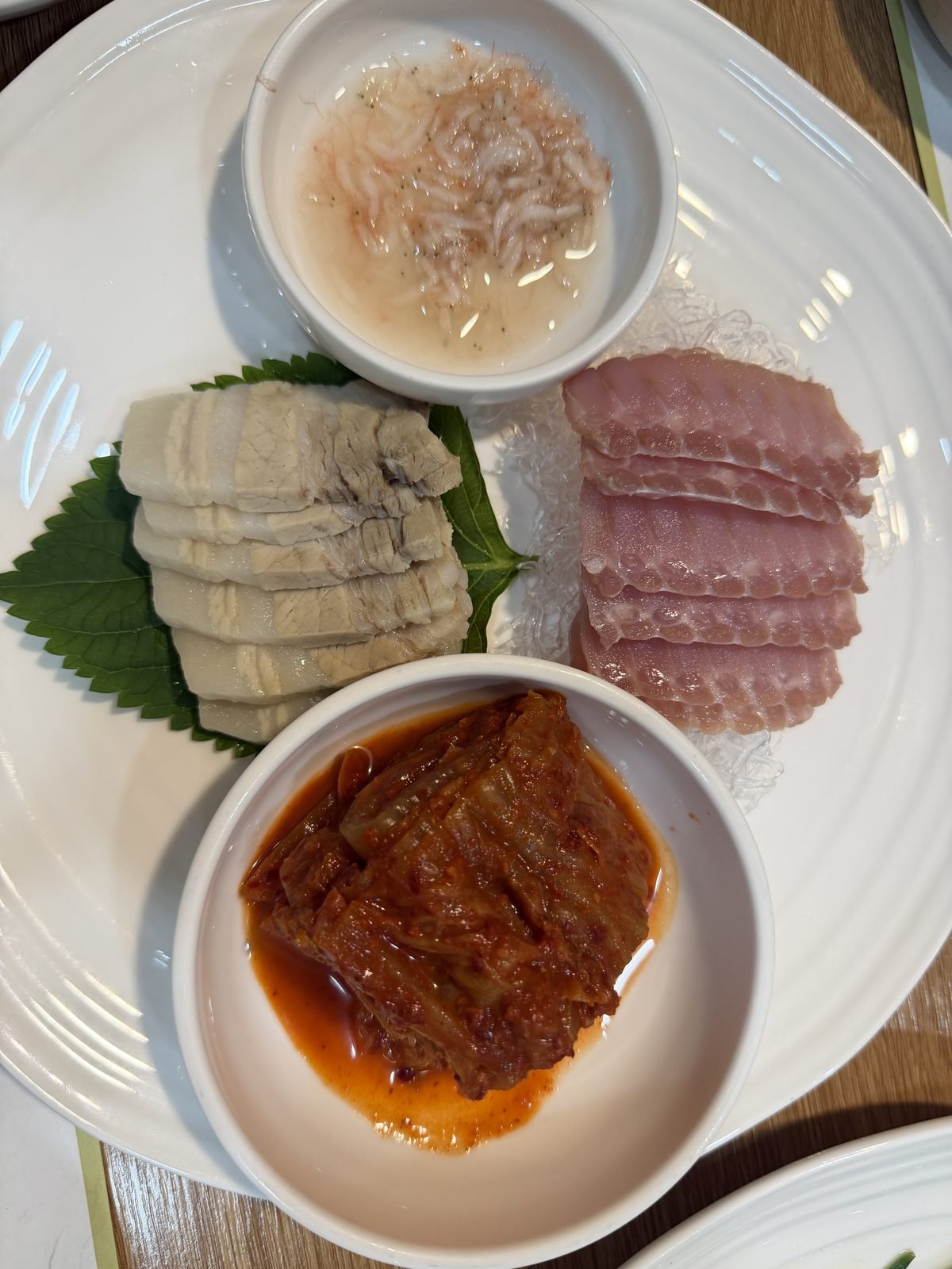 Hongeo samhap with fermented skate pork and aged kimchi at Gowonnim Seoul