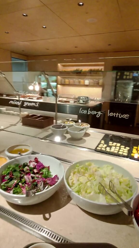 Salad bar with mixed greens and iceberg lettuce at the Korean Air lounge in Incheon Terminal 2