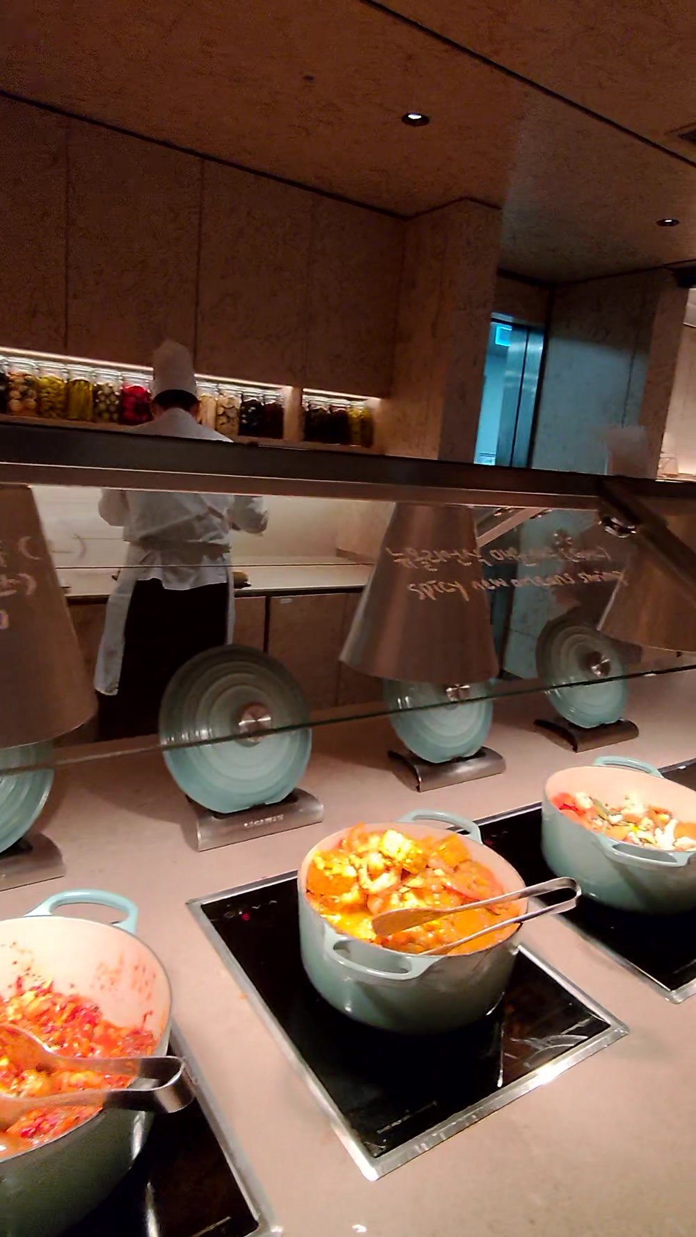 Hot stew pots on induction warmers at the Korean Air lounge in Incheon Terminal 2