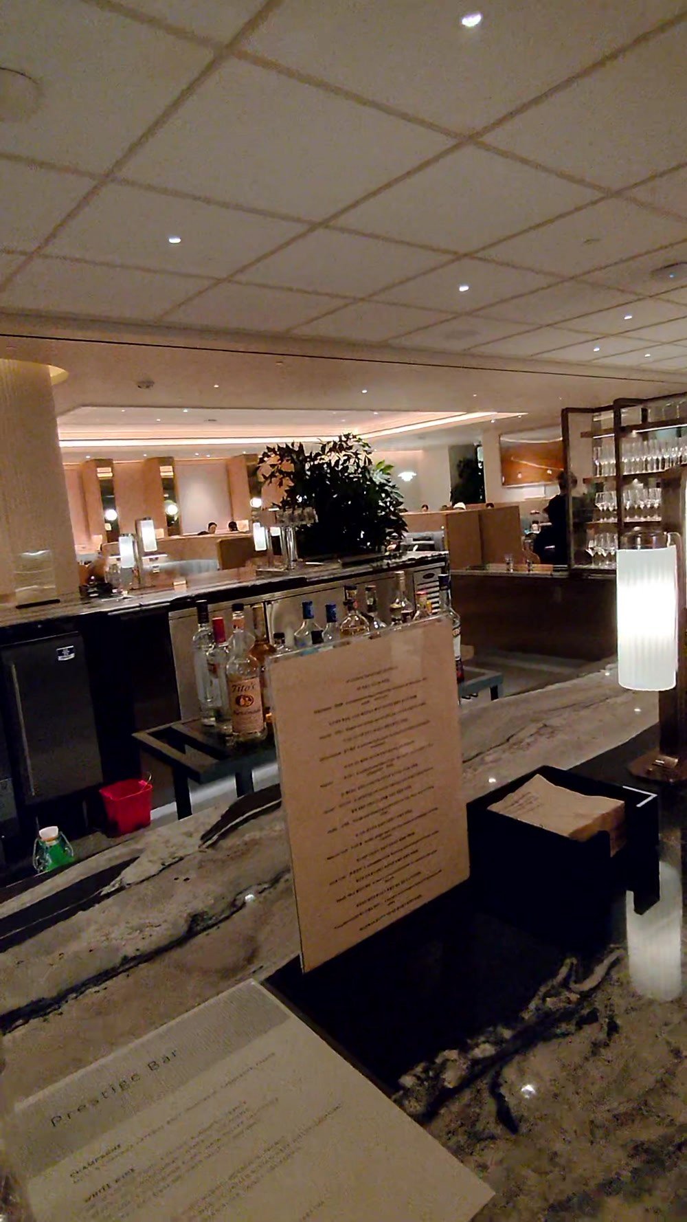 The Prestige Bar counter and bottles at the Korean Air lounge at LAX
