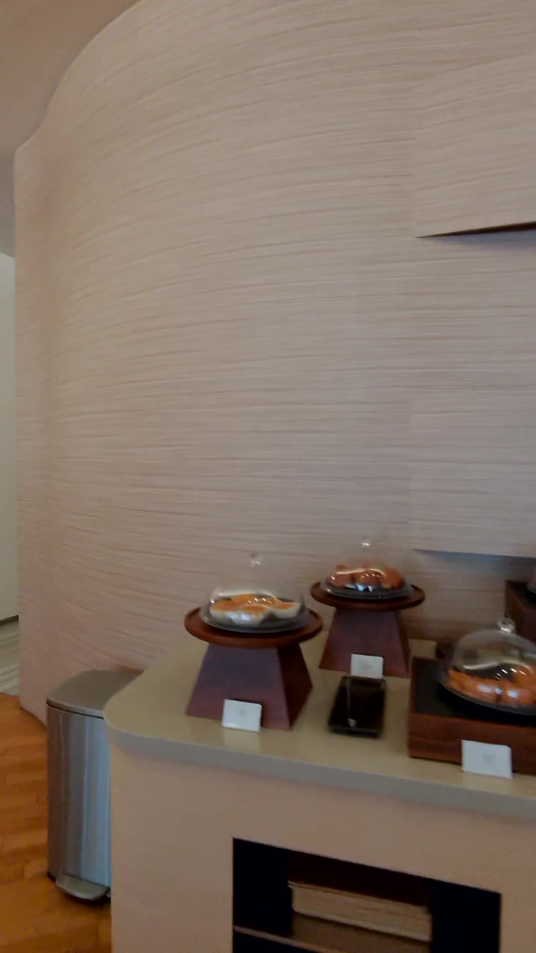 Covered serving dishes on the buffet counter at the Korean Air lounge at Narita Terminal 1