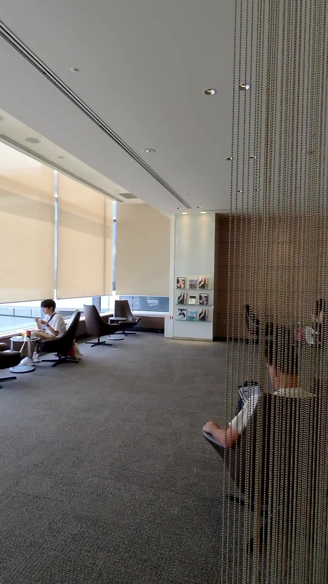 A quiet screened work area with seating at the Korean Air lounge in Narita Airport