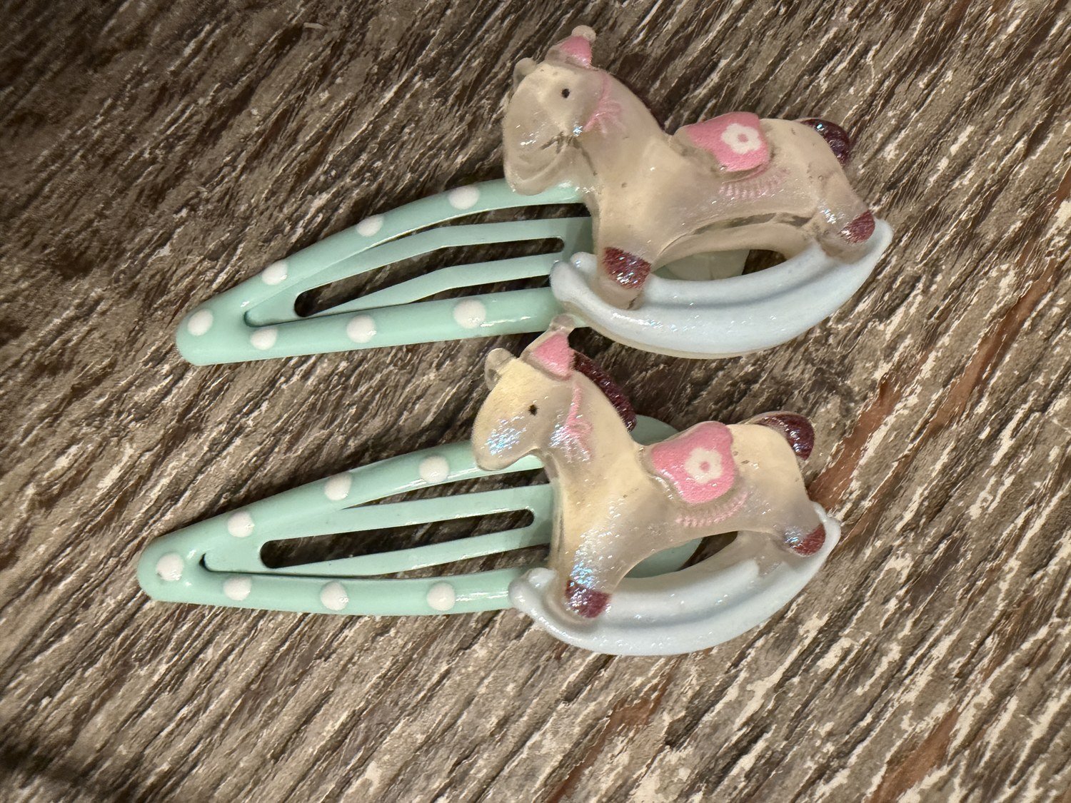 Mint polka dot snap clips with tiny rocking horses, bought in Harajuku