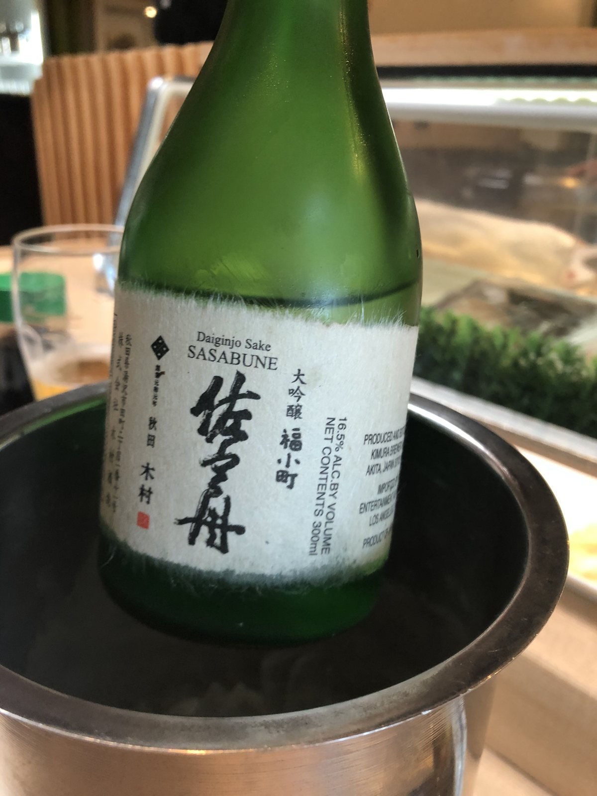 Beverly Hills Sasabune house daiginjo sake bottle chilling in an ice bucket