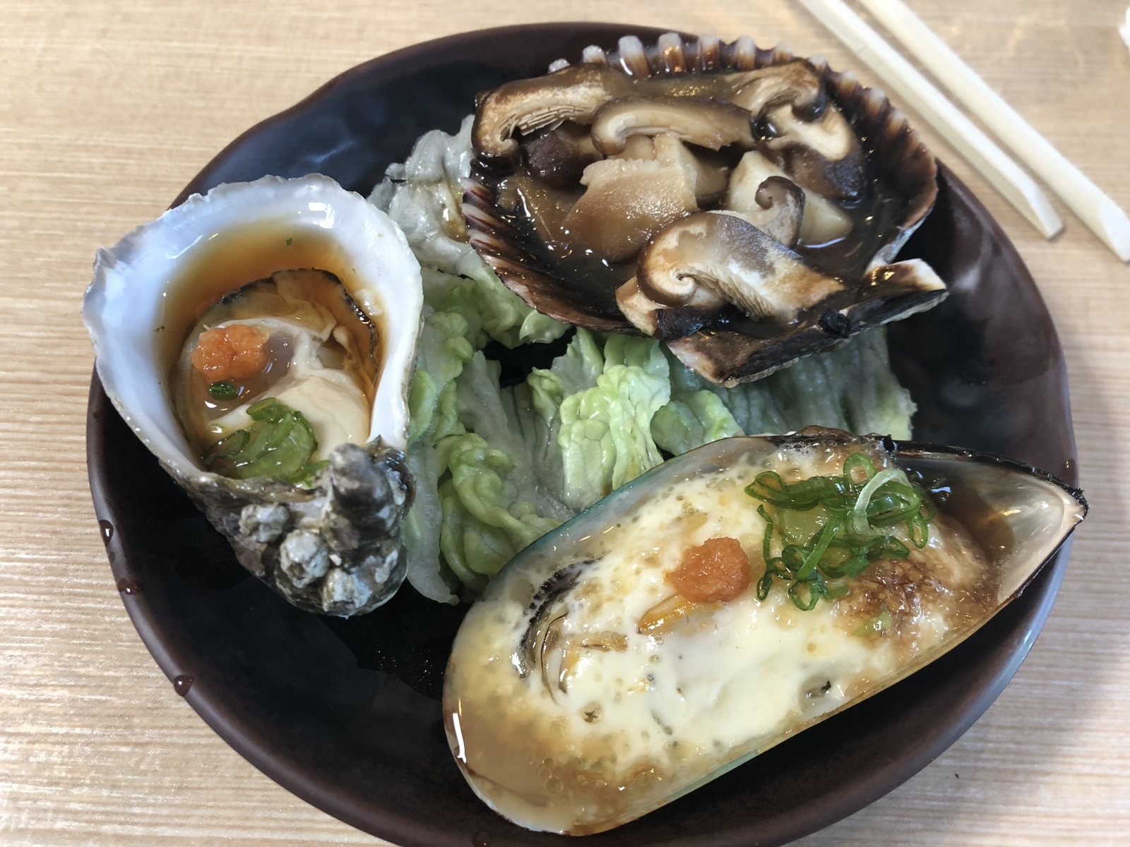 Beverly Hills Sasabune shellfish plate with raw oyster, shell with mushroom and baked mussel