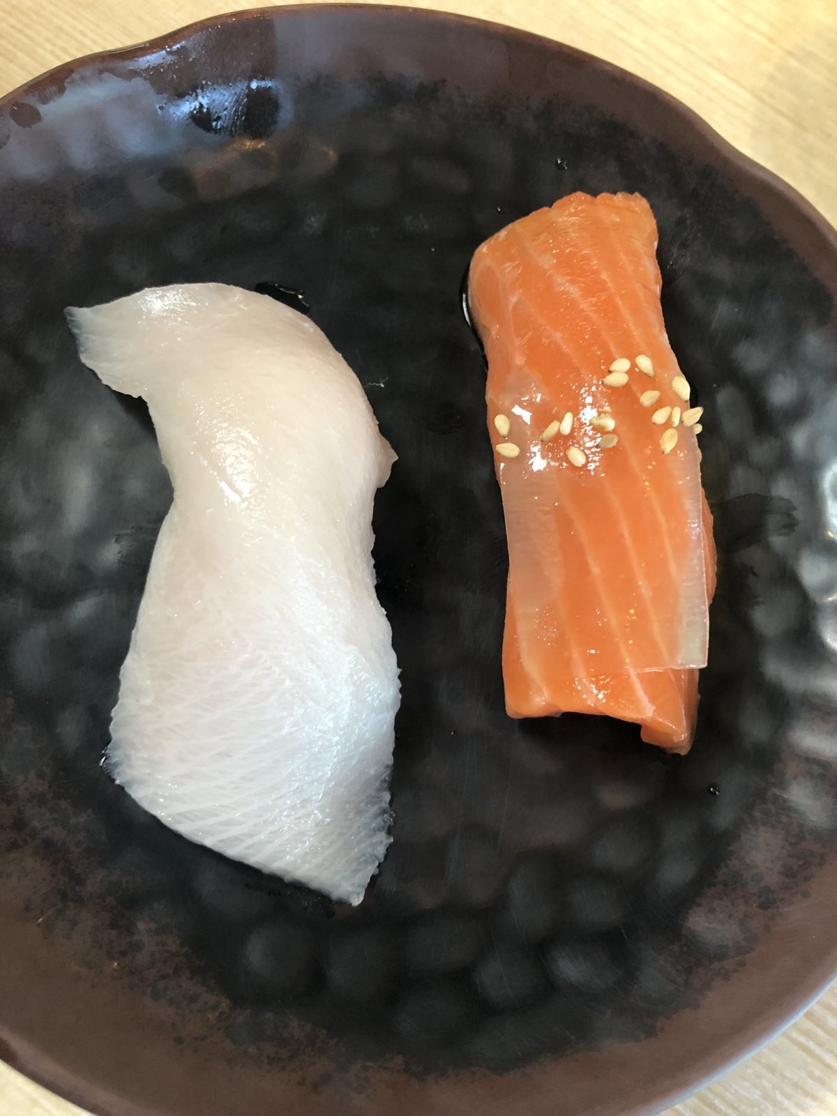 Beverly Hills Sasabune salmon nigiri with sesame beside white fish nigiri