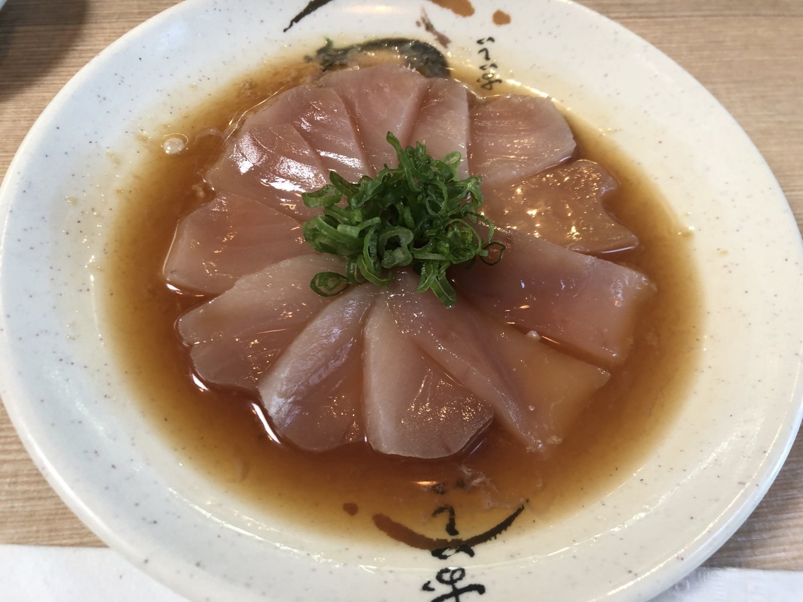 Beverly Hills Sasabune white fish sashimi fanned in ponzu with scallion