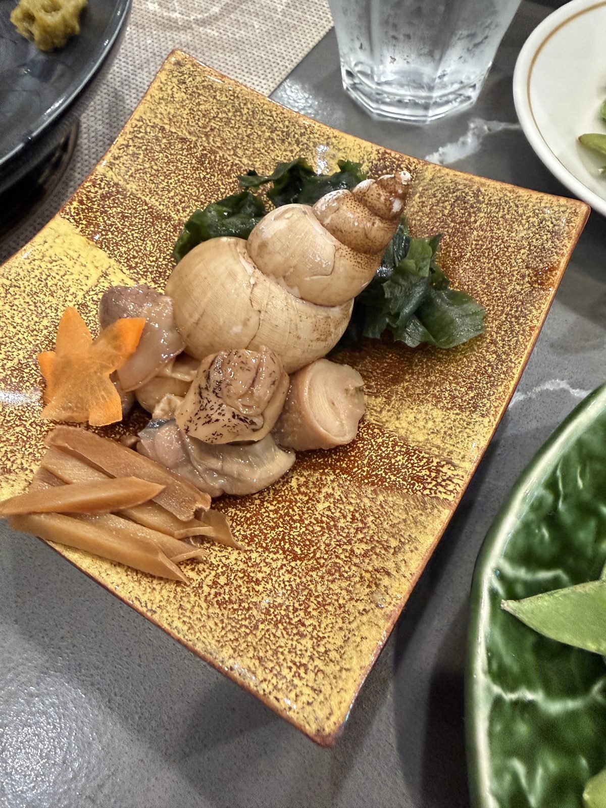 Simmered sea snail served with wakame and bamboo shoot at Matsumoto sushi