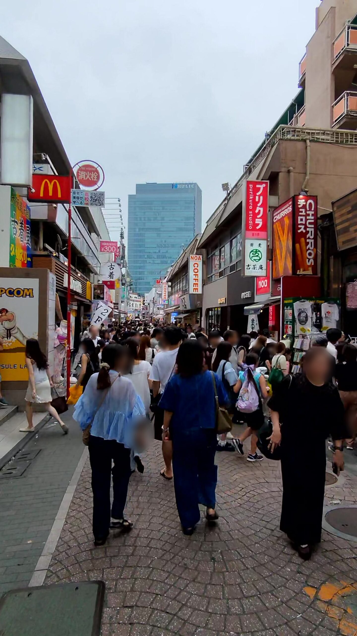 Crowds walking down Takeshita Street in Harajuku on a humid July afternoon