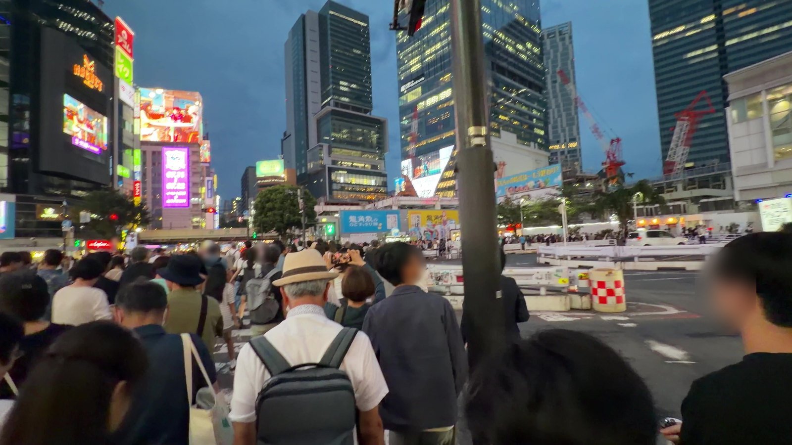 Walking across Shibuya Crossing in the middle of the crowd