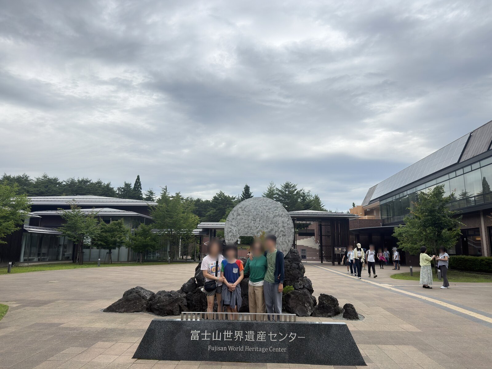 The Fujisan World Heritage Center building with a pale sphere on lava rock