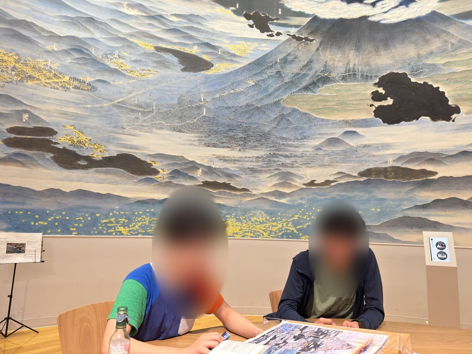 A reading room at the Fujisan World Heritage Center with a painted Mount Fuji mural