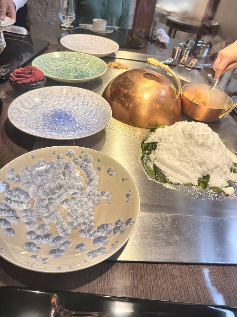 Tokyo Ginza Ukai-tei chef cooking under salt on the teppan