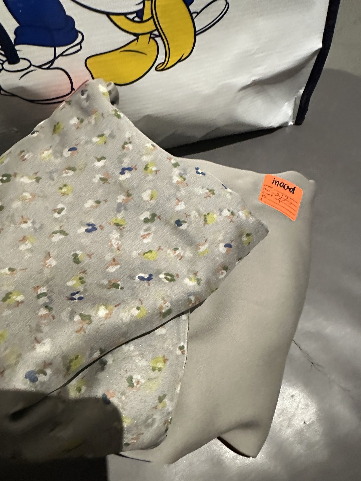 Grey silk chiffon with a tiny scattered floral print from Mood Fabrics in Los Angeles