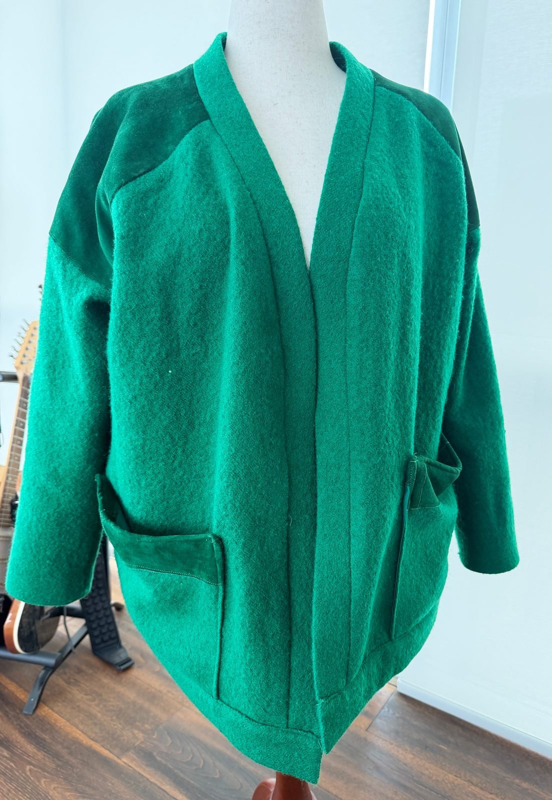Handmade green wool raglan cardigan with suede trim, cut without a pattern