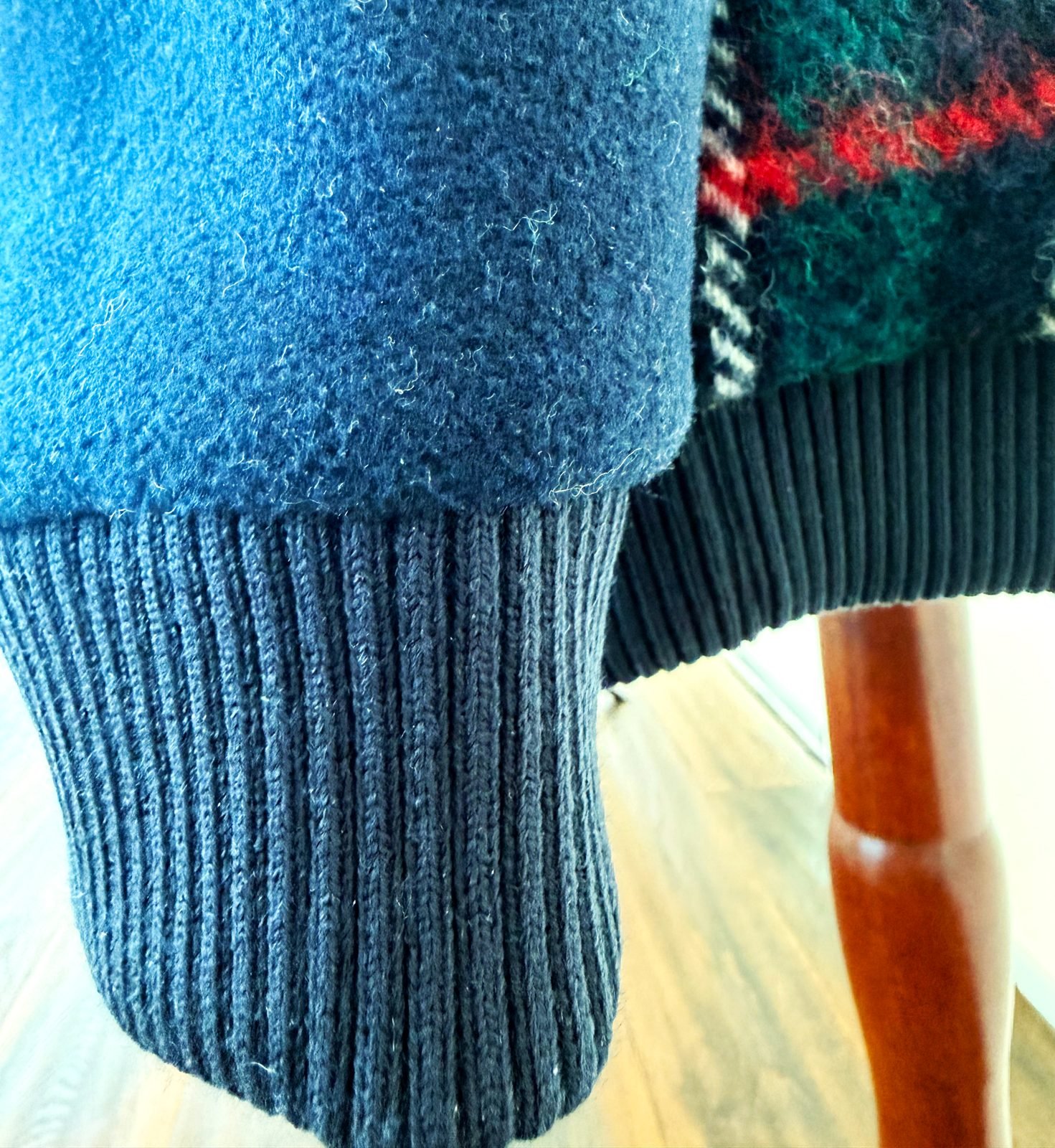Contrast ribbed cuff sewn onto the second cardigan when the wool ran short