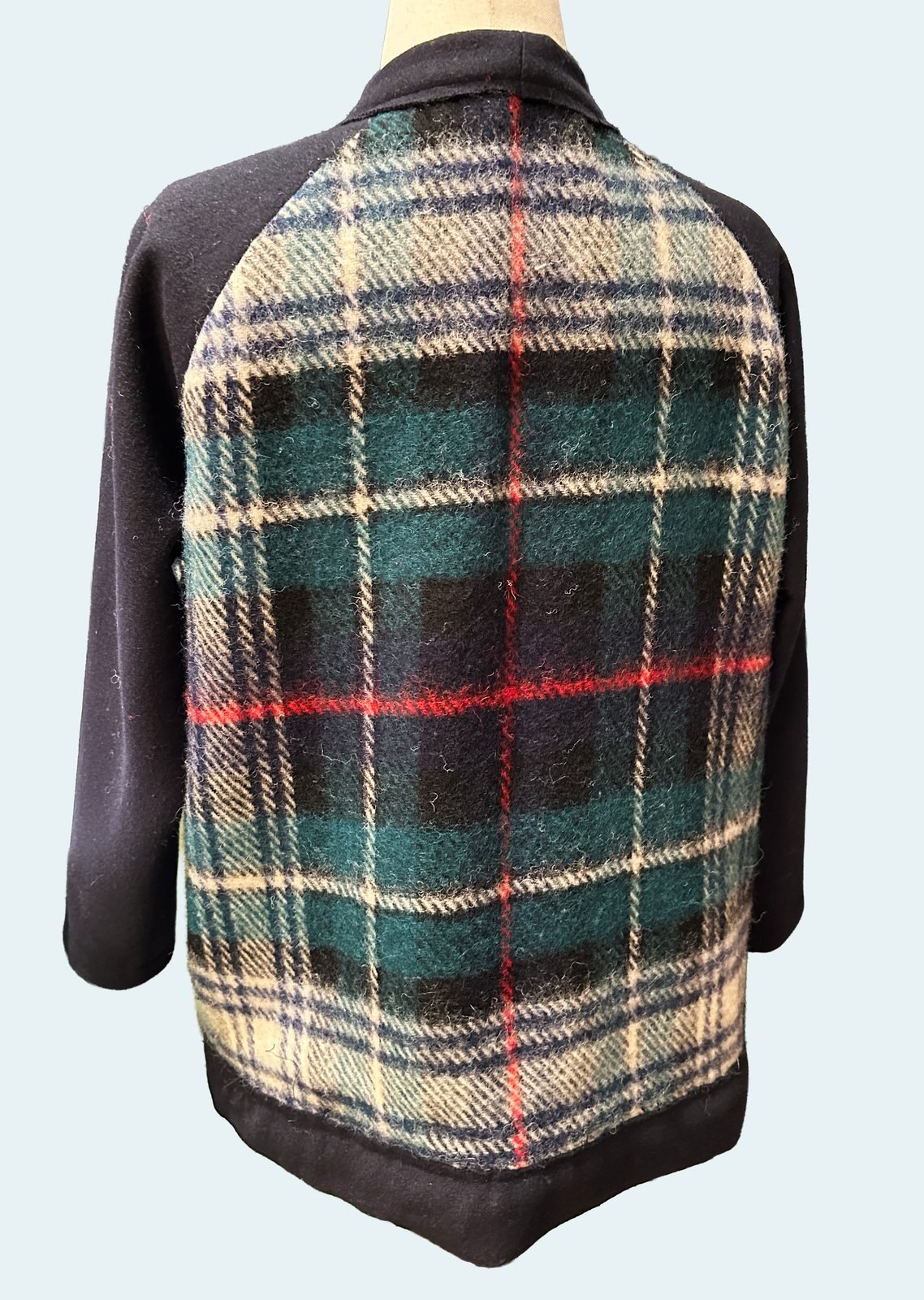 Back of the handmade plaid wool cardigan showing the full plaid panel