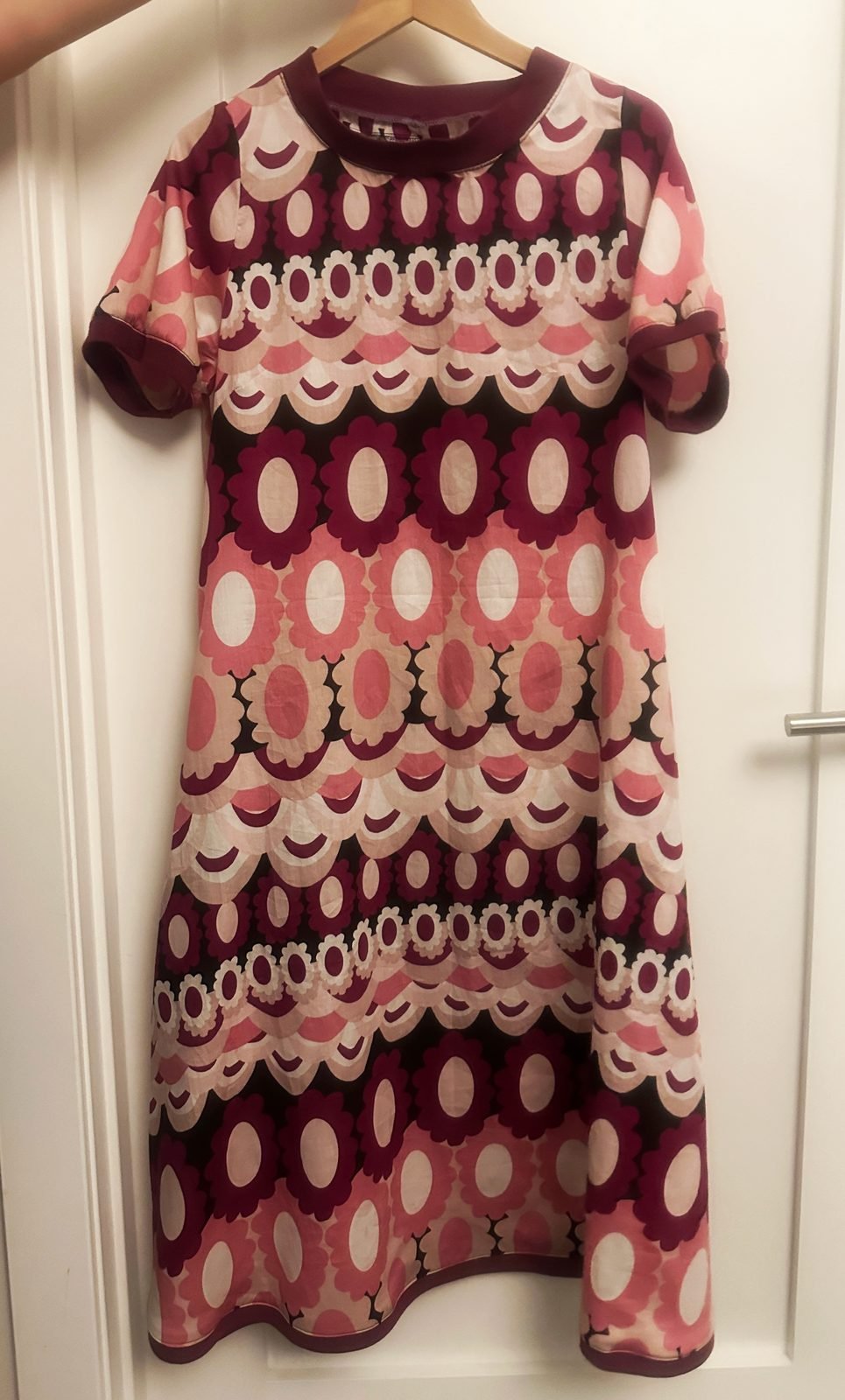 Handmade retro print shift dress bound at neckline, cuffs and hem in solid trim