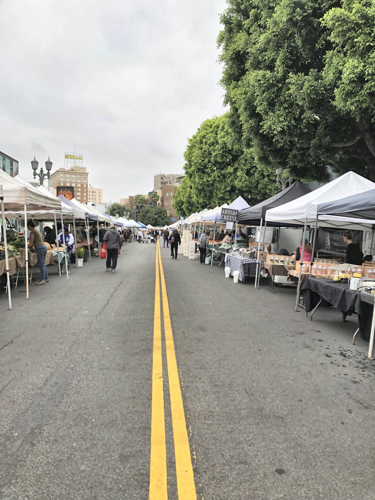 Empty tented aisle on Ivar Avenue at the Hollywood Farmers Market before it opens