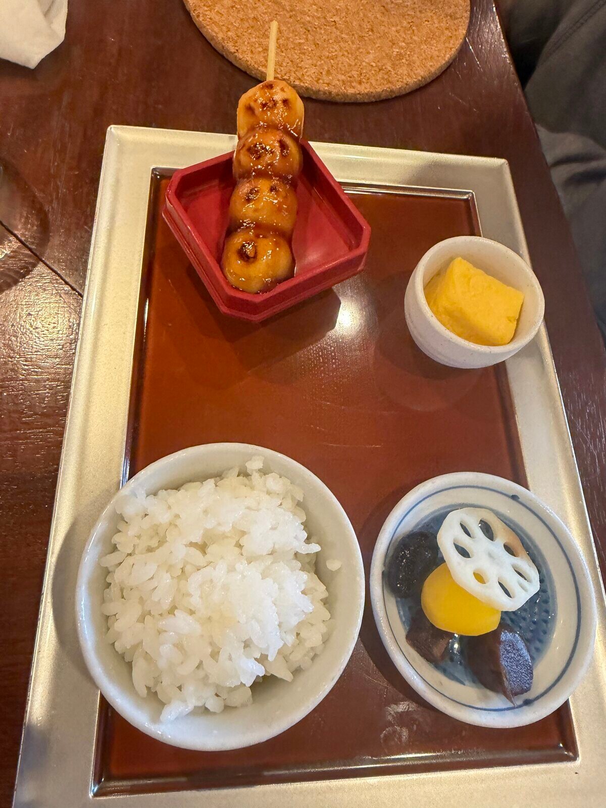 A hoto lunch set with rice, pickles and a dango skewer in Yamanashi