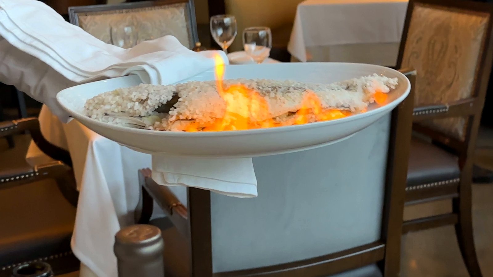 West Hollywood Madeo Ristorante whole fish baked in a salt crust and set on fire, carried through the dining room